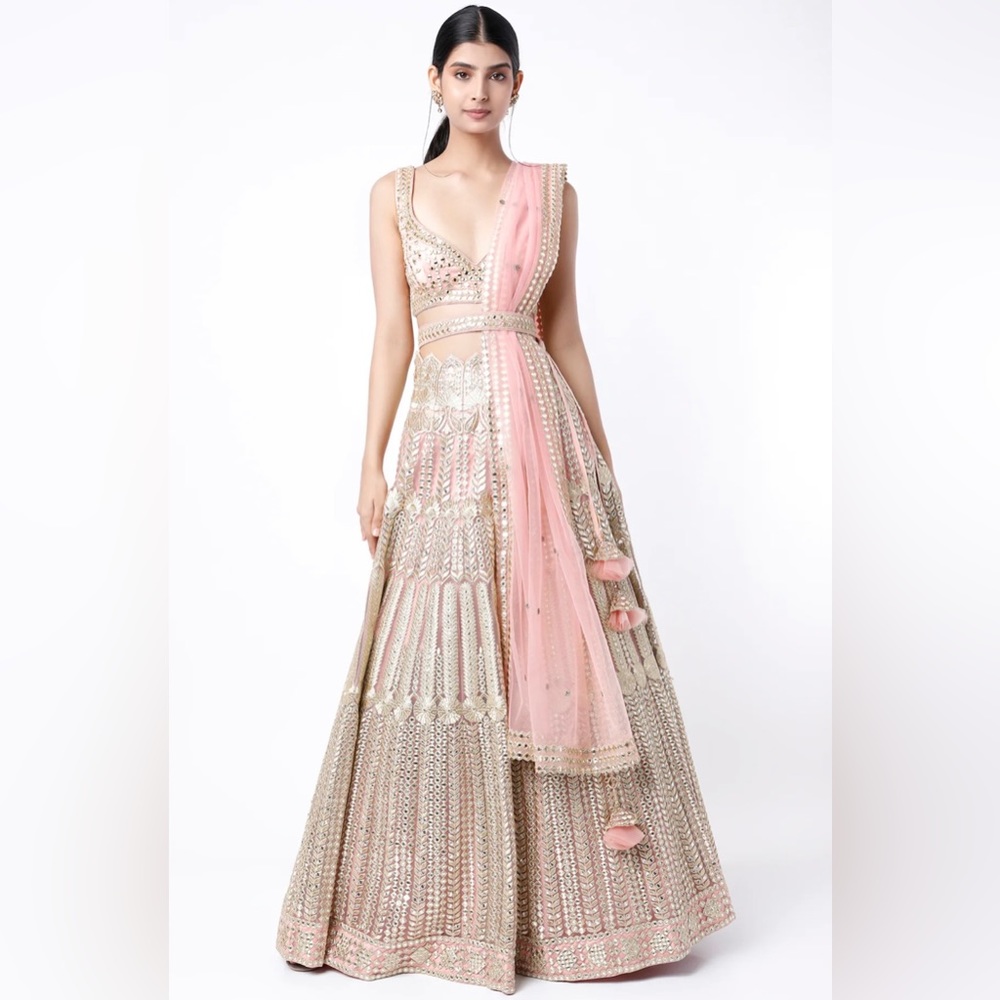 Suhino pinkish peach embroidered lehenga set from Pernia’s Pop Up Shop